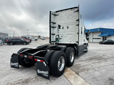 Freightliner Cascadia 126 tractor rear view showing dual rear axles and mud flaps with Bruckner’s branding