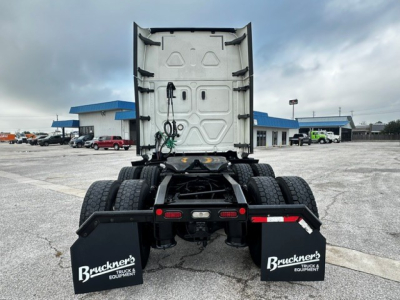 Freightliner Cascadia 126 tractor rear view showing fifth wheel and mud flaps with Bruckner's Truck Equipment branding.