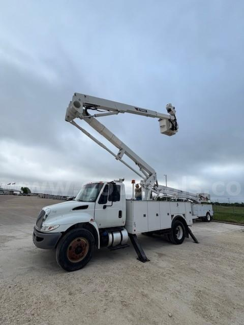 Truck mounted bucket crane on a 2019 International DuraStar 4300 in-service bucket truck with crane arm extended.