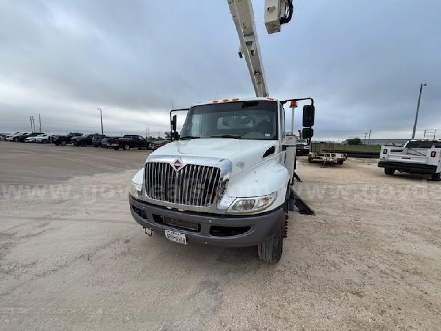 International DuraStar bucket crane truck front view showing cab and crane arm