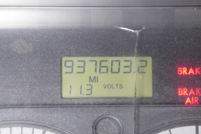 Vehicle instrument cluster showing odometer reading 937603.2 miles, 11.3 volts, and warning indicators for brake and air
