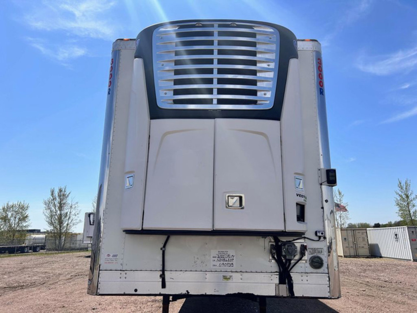 Rear view of a 2022 Utility reefer trailer showing cargo refrigeration unit with intake grille and doors.