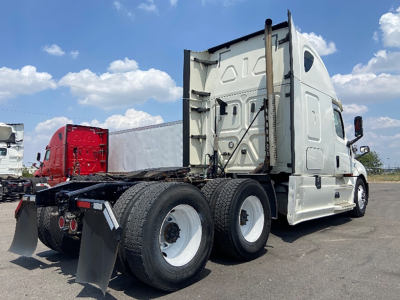 Freightliner Cascadia part of truck chassis showing rear axles and sleeper cab, 2020 model year.