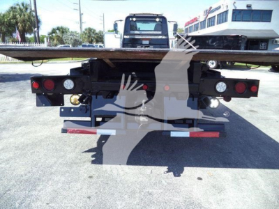 Truck rear showing rollback bed with taillights and bumper, International Workstar rear, stock number T26270, VIN 3HAGSSNT6GL226270.