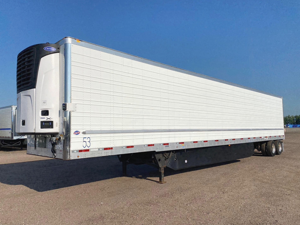 Utility reefer trailer 2020 model with white side panels and a front refrigeration unit showing a liftgate recess and wheel area.