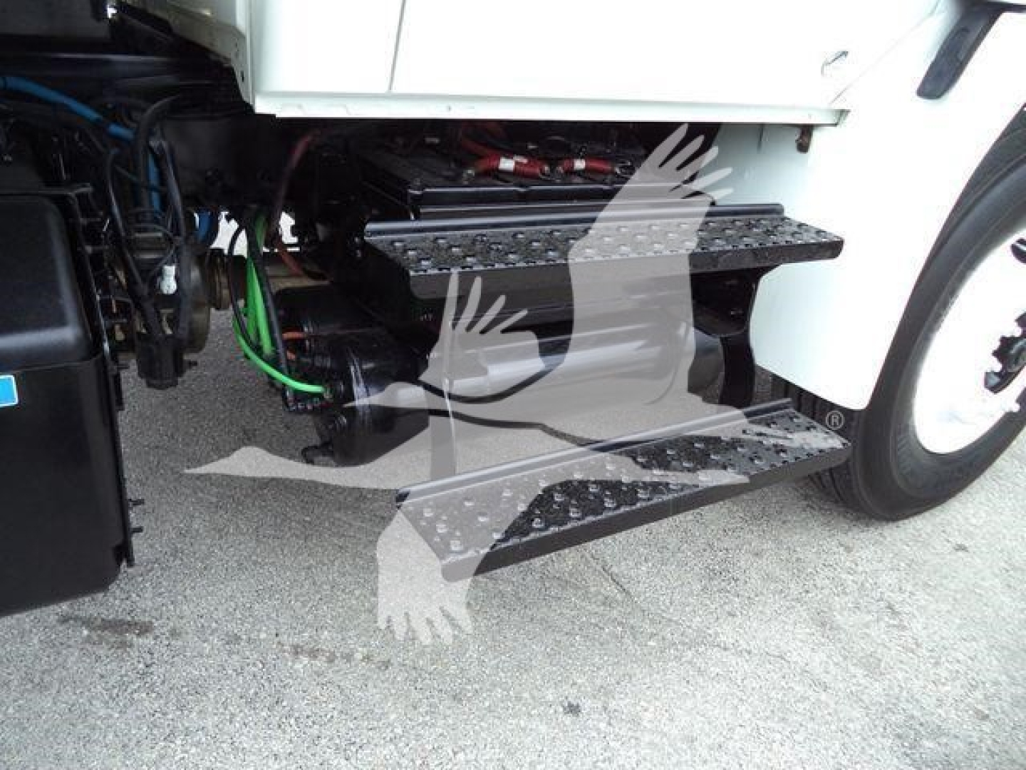 International 2019 4300 truck steps and engine bay view showing side step/steps and under-hood components