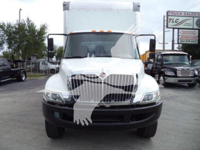 Front view of a white 2019 International 4300 box truck with grille, bumper, and large cargo cab; stock number T14761FM in a dealership lot.