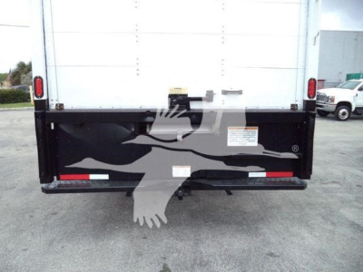 Truck tailgate of a 2019 International 4300 box truck showing back panel labels and reflectors.