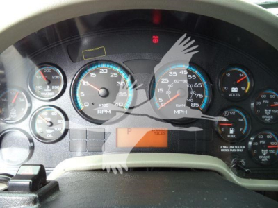 Dashboard of 2019 International 4300 showing gauges including RPM, MPH, fuel, water temp, and warning indicators; center digital display area with 'P' and 'H' peeking.