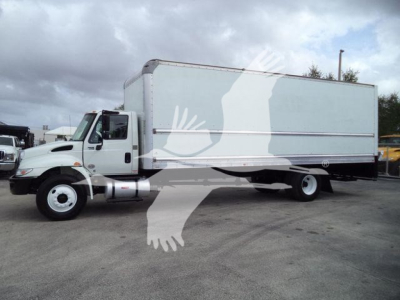 Box truck with white cab and large gray box body, side view showing right side and cab.