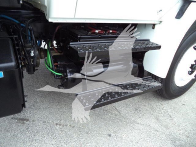 International 2019 4300 truck steps and engine bay view showing side step/steps and under-hood components