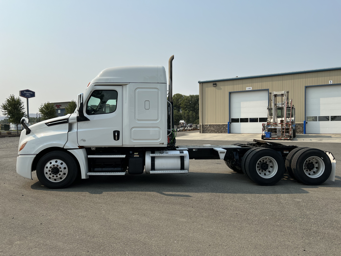 Truck cab and chassis of a 2020 Freightliner Cascadia 126 with sleeper cab, side profile, VIN sticker visible on stock tag area.