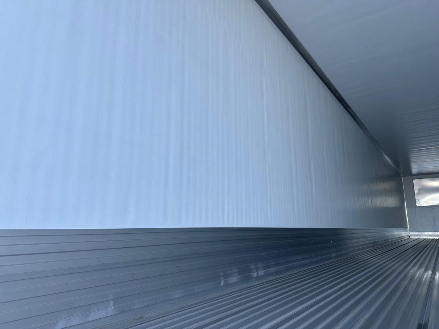 Trailer interior of a 2026 Utility 3000R reefer trailer showing aluminum side walls and ribbed floor