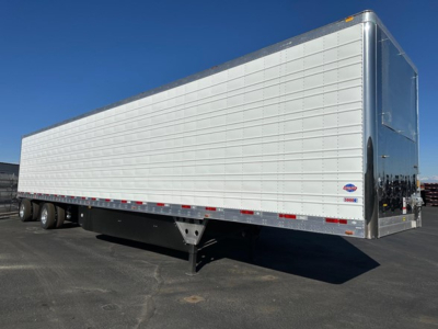  trailer showing side view of a 2026 Utility 3000R refrigerated trailer with white aluminum panels and black landing gear undercarriage.