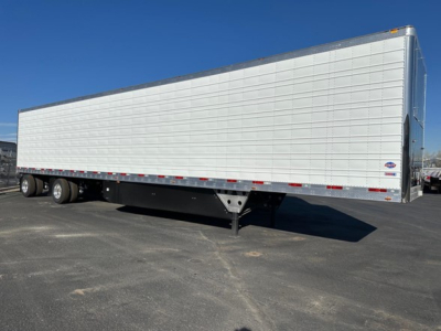 Utility 3000R trailer side view showing silver aluminum reefer body with tandem axles and landing gear.