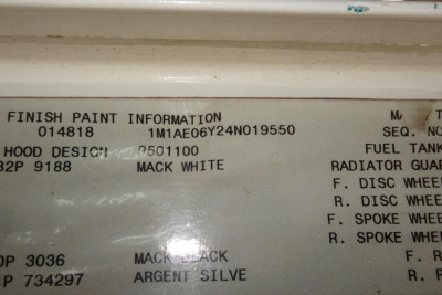 Mack CX Vision CX613 cab area plate showing finish paint information and color codes on the door jamb data tag.