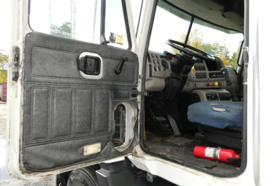 Mack CX Vision CX613 truck cab interior and door panel view from open driver door.