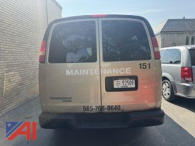 Rear view of a beige 2012 Chevrolet Express LS2500 cargo van with 'MAINTENANCE' text on back, number 151, license plate visible, phone number 585-768-8640 near bumper.
