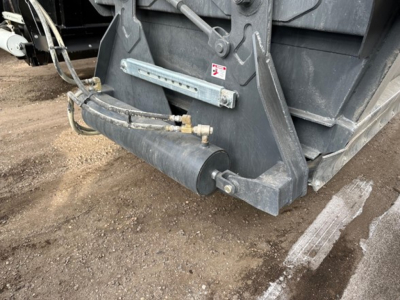 Trailer hitch and hydraulic components of a CPS 40' air ride bottom dump showing hydraulic lines and mounting hardware.
