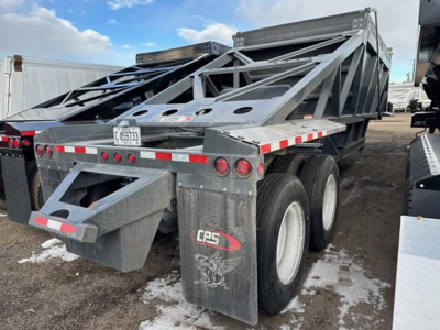 CPS air ride bottom dump trailer with dual rear axle and gray metal frame, showing rear view and registration plate C45393. Weathered surface with reflective tape and CPS logo on mud flaps.