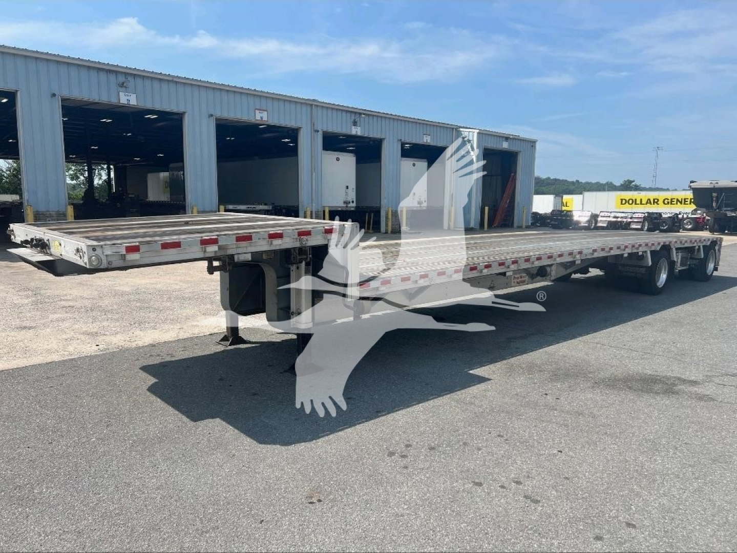 Trailer deck showing 2021 Reitnouer dropdeck trailer with long flatbed sections and tandem axles, VIN 1RND48A22MR055343, stock 7251.