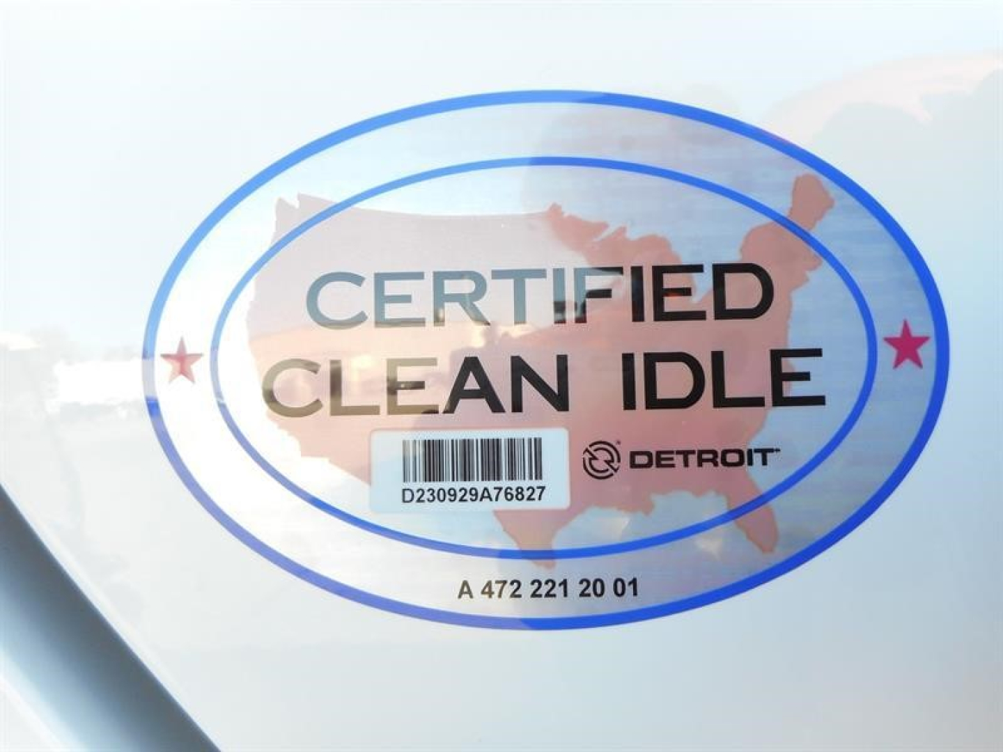 Certified Clean Idle badge sticker on a white vehicle surface showing DETROIT logo and map outline.