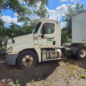 2013 Freightliner Cascadia daycab truck shown in-side view with cream exterior, cab details visible, logo on door reading Lemante? and contact text, left front wheel, attached trailer connection.