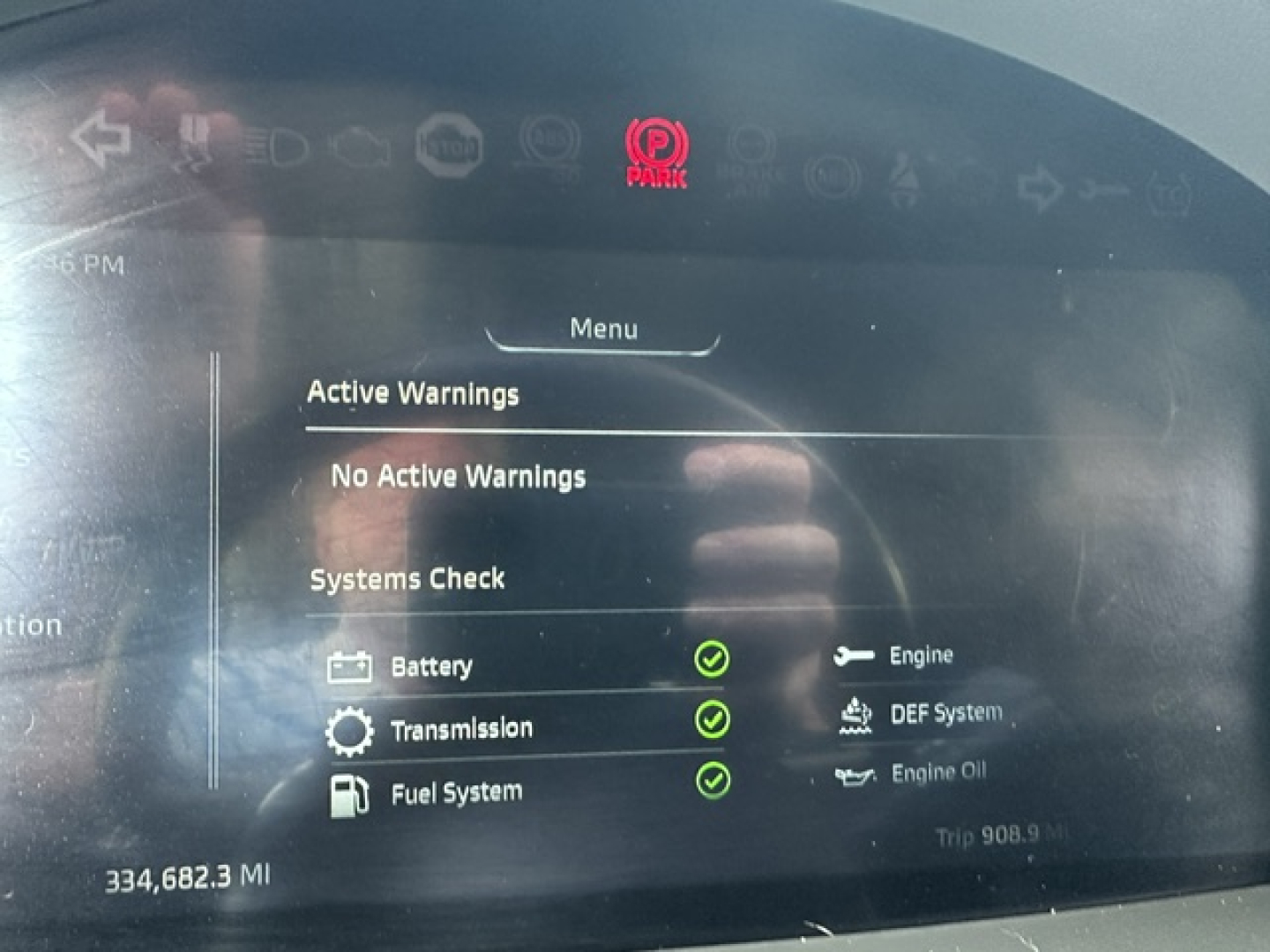 Digital instrument cluster displaying System Check: Battery, Transmission, Fuel System all with green checks; 'Active Warnings' shows No Active Warnings; various icons and trip data visible.
