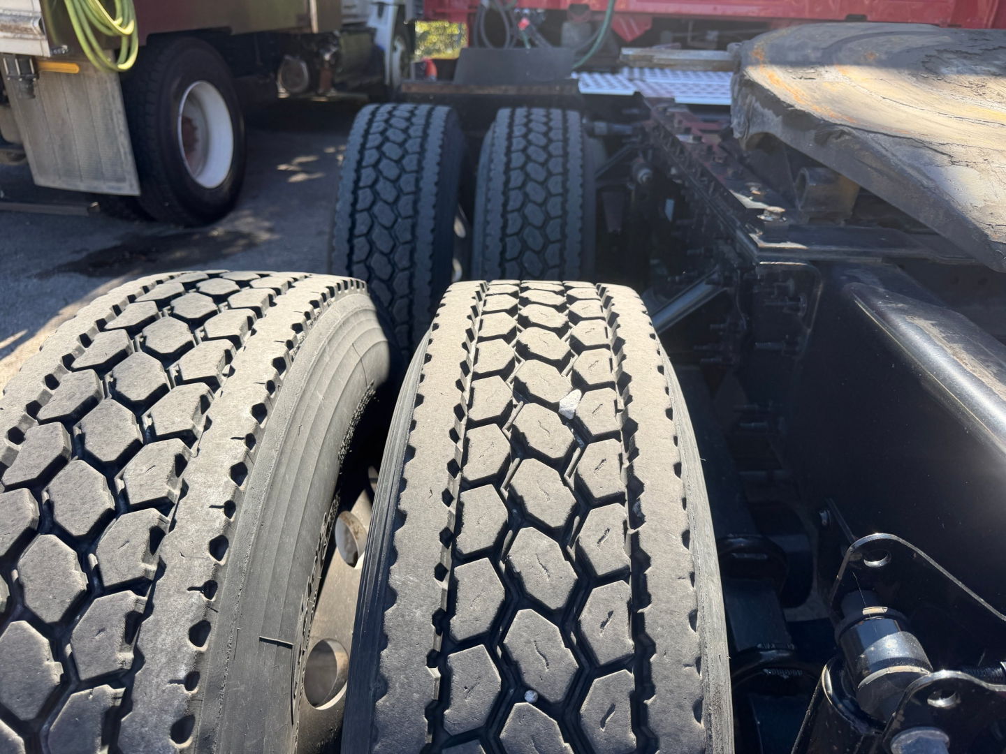 Volvo VNL64T760 truck rear duals showing tires and chassis components.