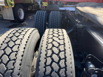 Volvo VNL64T760 truck rear duals showing tires and chassis components.