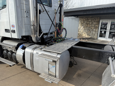 Volvo VHD64FT300 truck cab and fuel tank/step area in view showing exterior components and chassis.