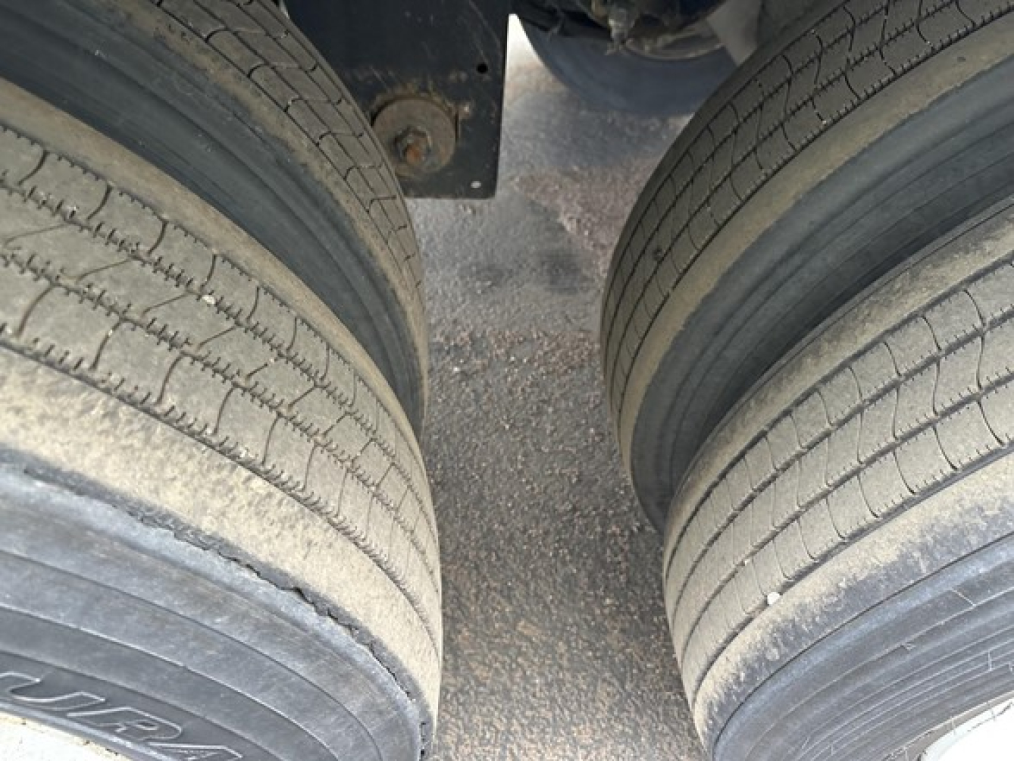 Trailer dual rear tires (dually) on Utility 4000D-X in-service condition showing tread and wheel area.