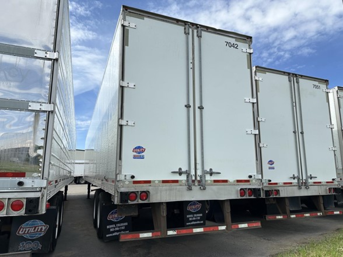 Utility 4000D-X trailer rear view showing dual rear doors and taillights on a commercial trailer.