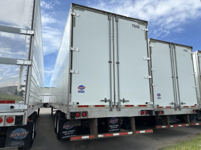 Utility 4000D-X trailer rear view showing dual rear doors and taillights on a commercial trailer.