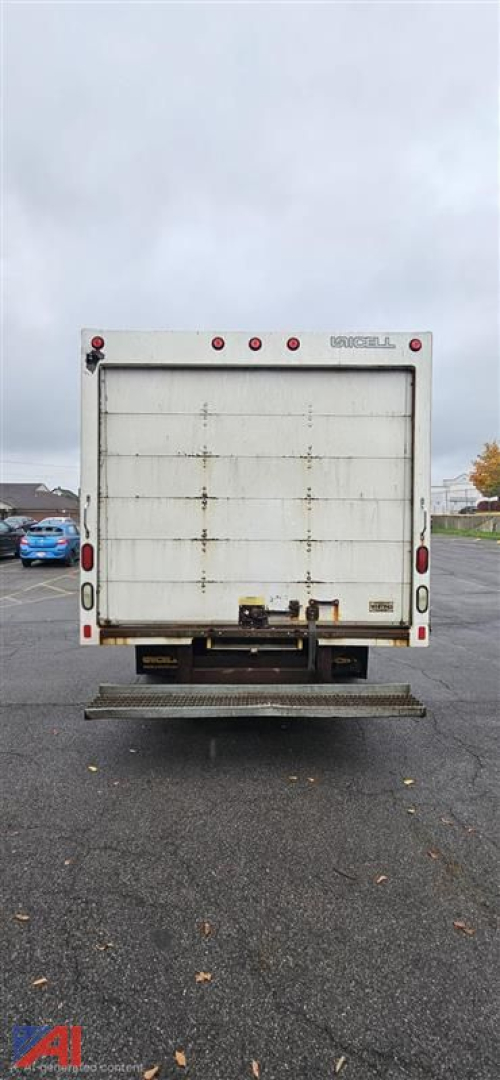 GMC Savana 3500 cutaway rear view showing cargo box doors and rear bumper.