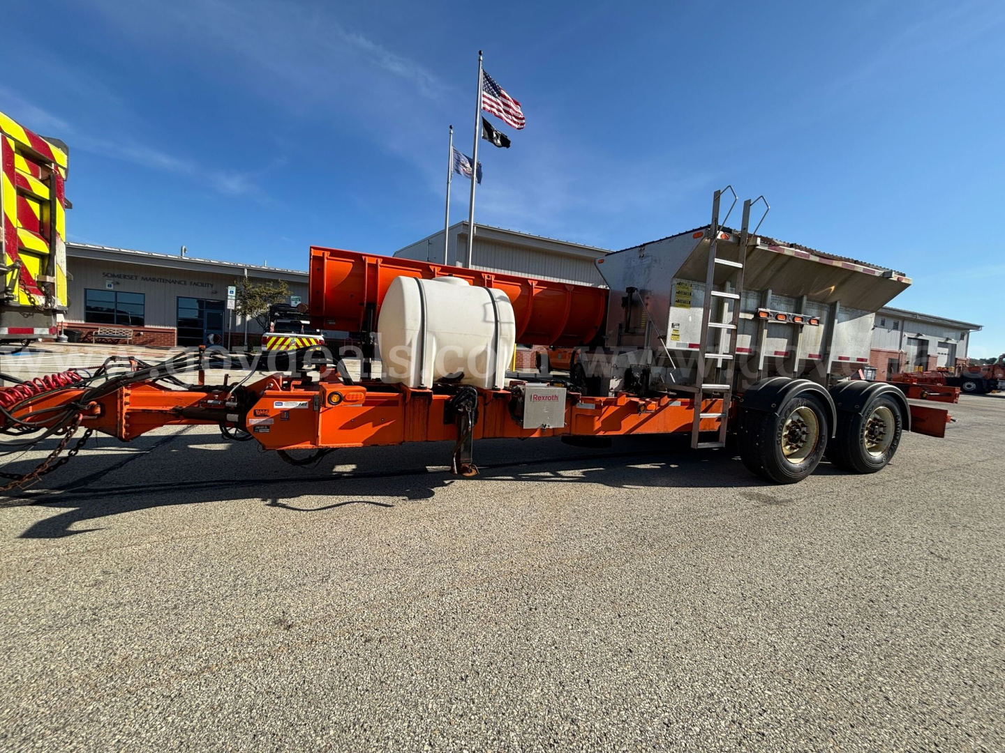 Mack GU granite plow truck trailer showing water tank and hydraulic equipment