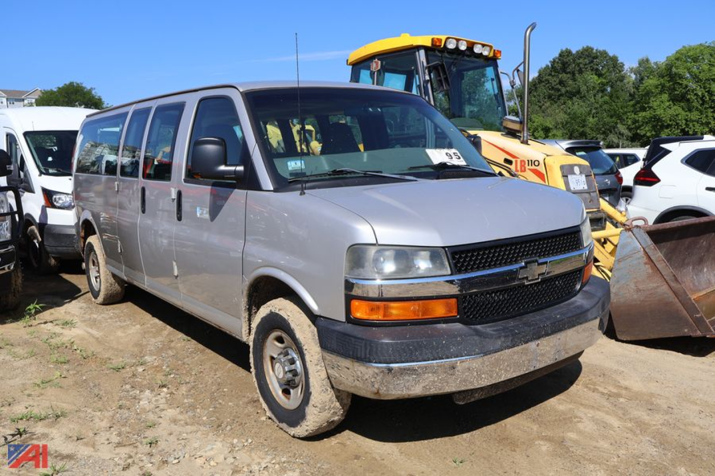 2007 Chevrolet Express 3500 van shown front-side view with dirt on bumper and tires, cargo van in used condition.