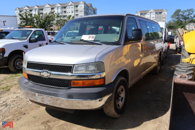 Chevrolet Express 3500 van in service view showing front grille with Chevrolet emblem and side mirrors.