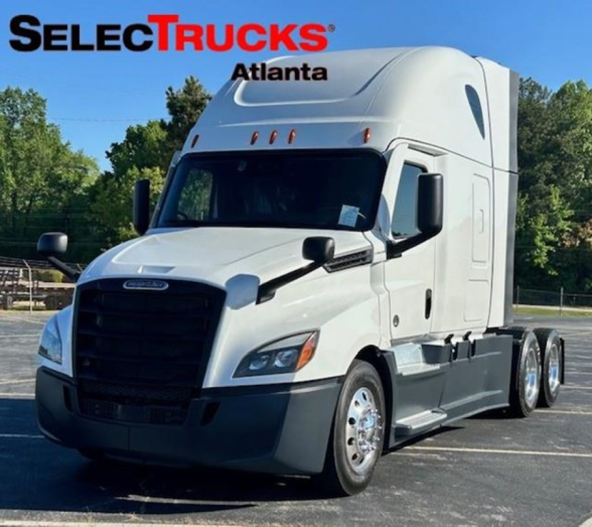 Semi truck cab in profile with SelectTrucks Atlanta branding and company logo on image
