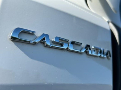 Cascadia badge on Freightliner Cascadia 126 truck showing CAST and model lettering.