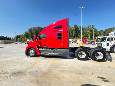 Kenworth T680 sleeper cab tractor in red, side profile view.