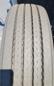 Tire tread close-up on Kenworth T680 wheel as seen on a used truck.