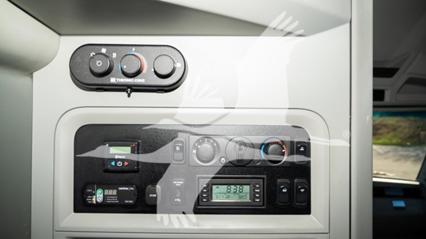 Kenworth T680 dash and controls panel with climate and media gauges visible