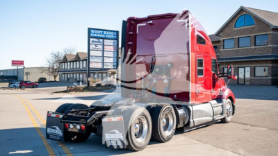 Kenworth T680 conventional sleeper truck rear view showing chassis and rear wheels.