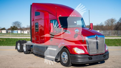Kenworth T680 truck in red with sleeper cab, front grille and dual rear axles visible.