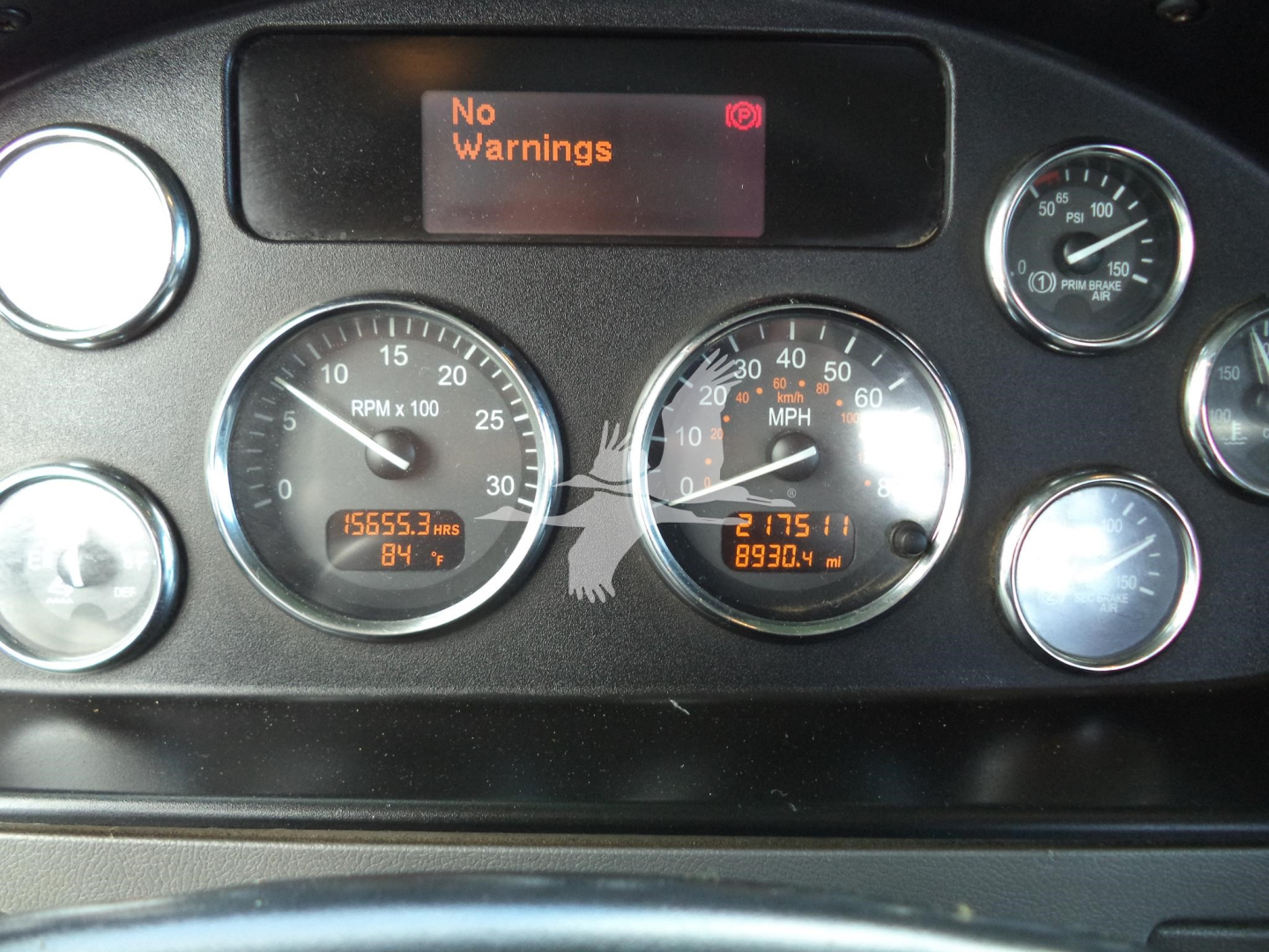 Peterbilt dashboard showing several gauges with digital readouts and 'No Warnings' on the display.