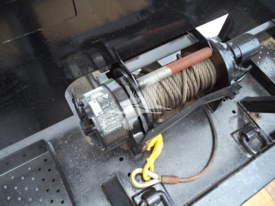 Peterbilt 348 rollback showing winch drum and steel wire rope with hook and motor side view