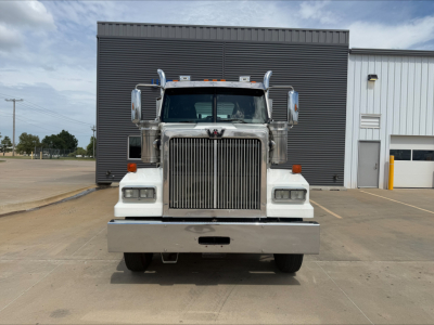 Front view of a white 2019 Western Star 4900 SF truck showing grille, bumper, and headlights.