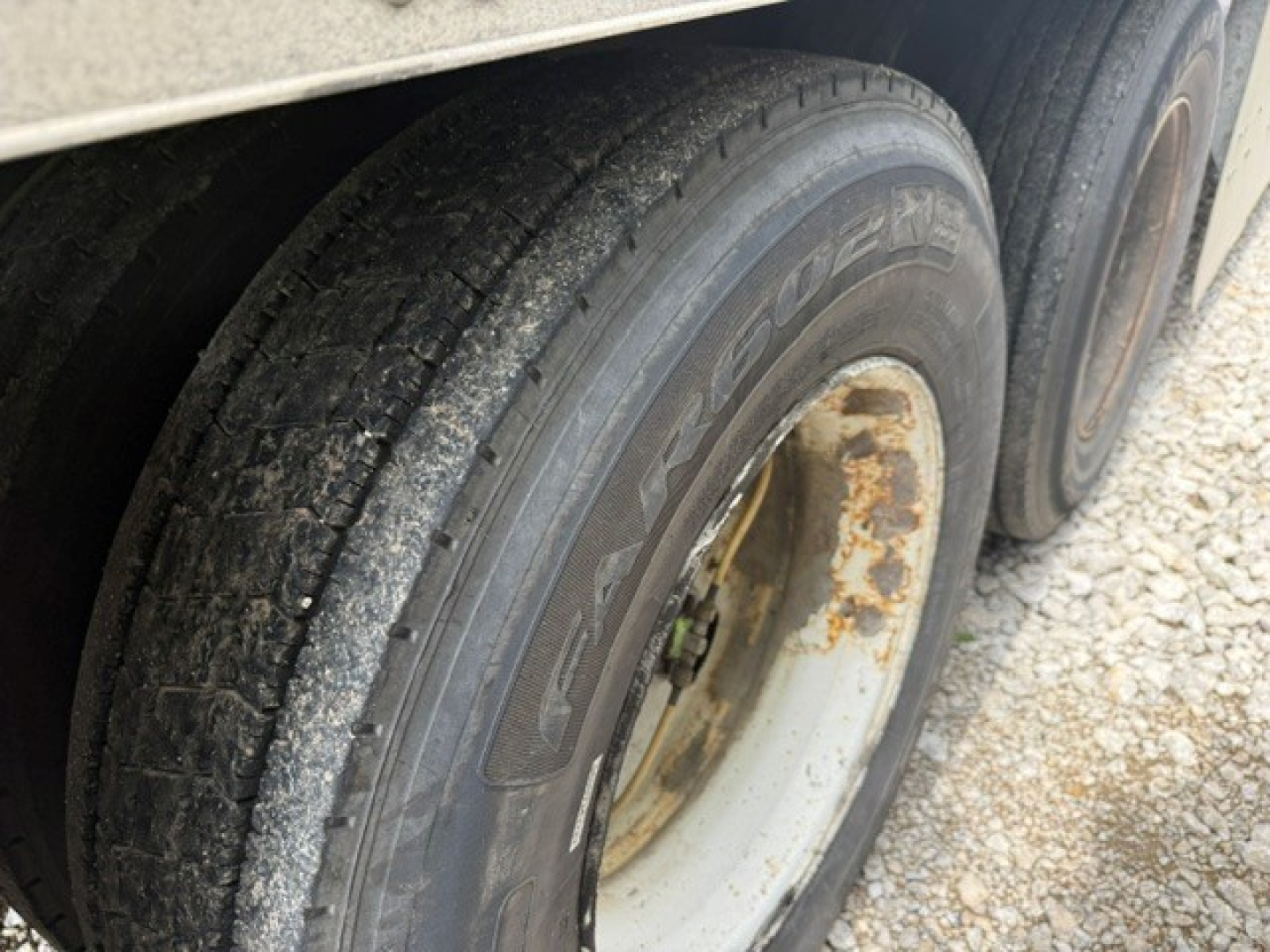 Trailer axle with dual tires showing Goodyear tires and wheel rims; part of a 2016 Utility 4000DX trailer.