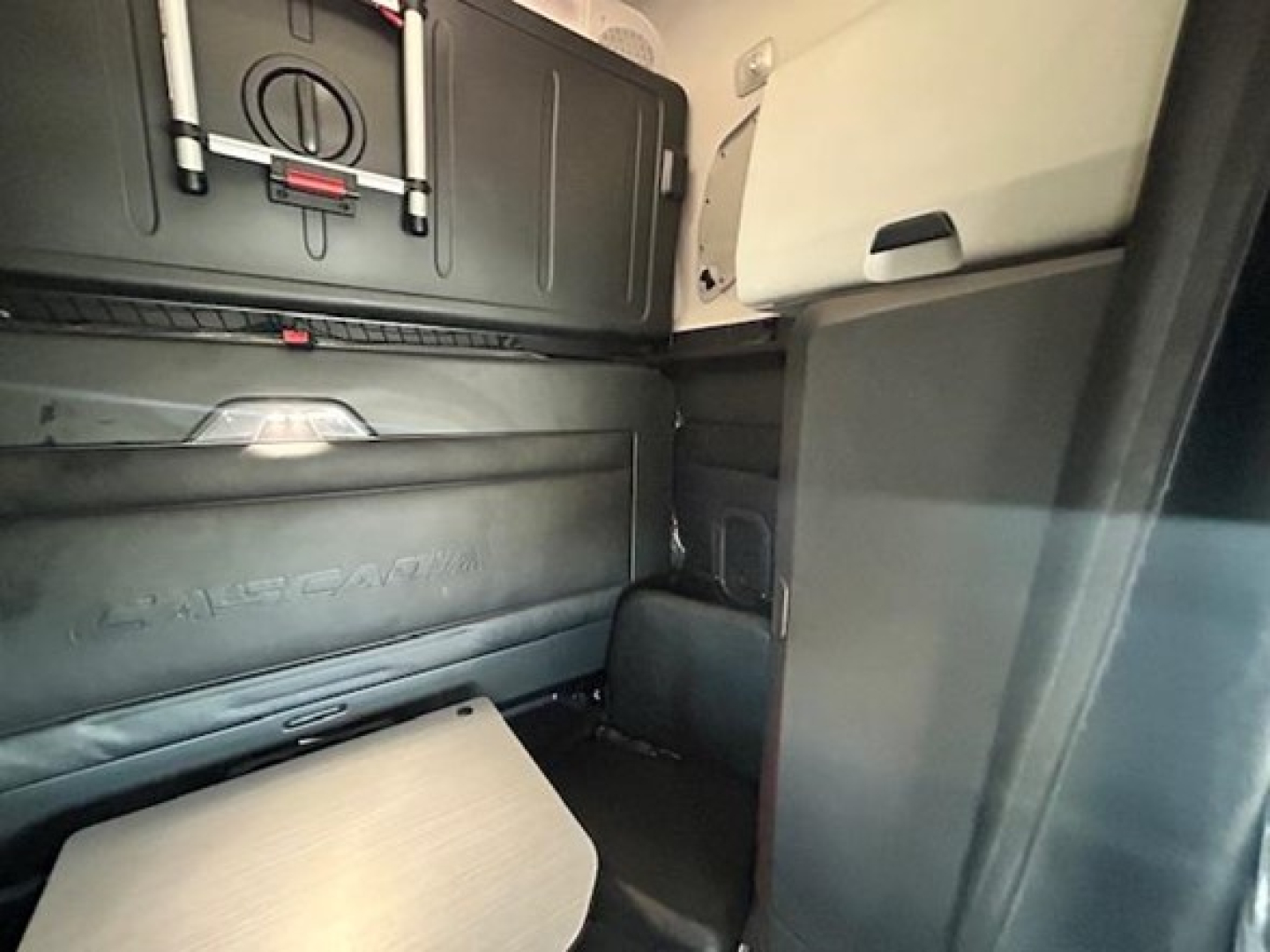 Freightliner Cascadia 126 cab interior showing sleeper area and storage compartments.